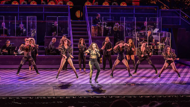 A scene from ‘On Your Feet, the Story of Emilio and Gloria Estefan,’ in performance at The Muny Theatre, photo by Phillip Hamer. A scene from ‘On Your Feet, the Story of Emilio and Gloria Estefan,’ in performance at The Muny Theatre, photo by Phillip Hamer.