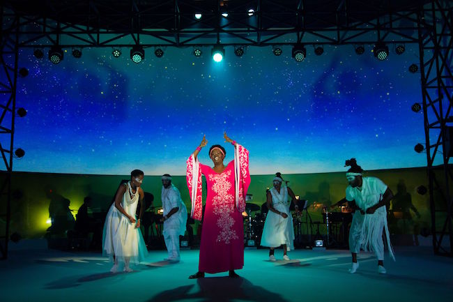Somi Kakoma, as Miriam Makeba, is joined by the ensemble and musicians in The Rep St Louis world premier of 'Dreaming Zenzile,' photo by T Charles Erickson. Somi Kakoma, as Miriam Makeba, is joined by the ensemble and musicians in The Rep St Louis world premier of 'Dreaming Zenzile,' photo by T Charles Erickson.