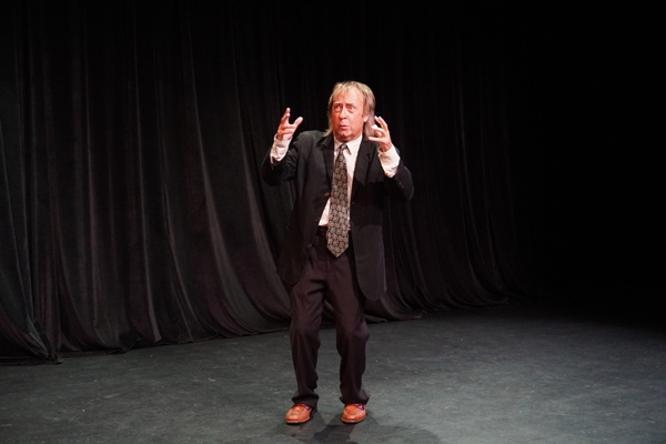 Joe Hanrahan in a scene from The Midnight Company production of 'Here Lies Henry,' a one-act, one actor show by Daniel MacIvor; photo by Joey Rumpell. Joe Hanrahan in a scene from The Midnight Company production of 'Here Lies Henry,' a one-act, one actor show by Daniel MacIvor; photo by Joey Rumpell.